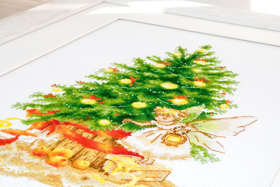 Christmas Tree B1117L Counted Cross-Stitch Kit featuring Aida canvas, colorful threads, and needle for holiday crafting.